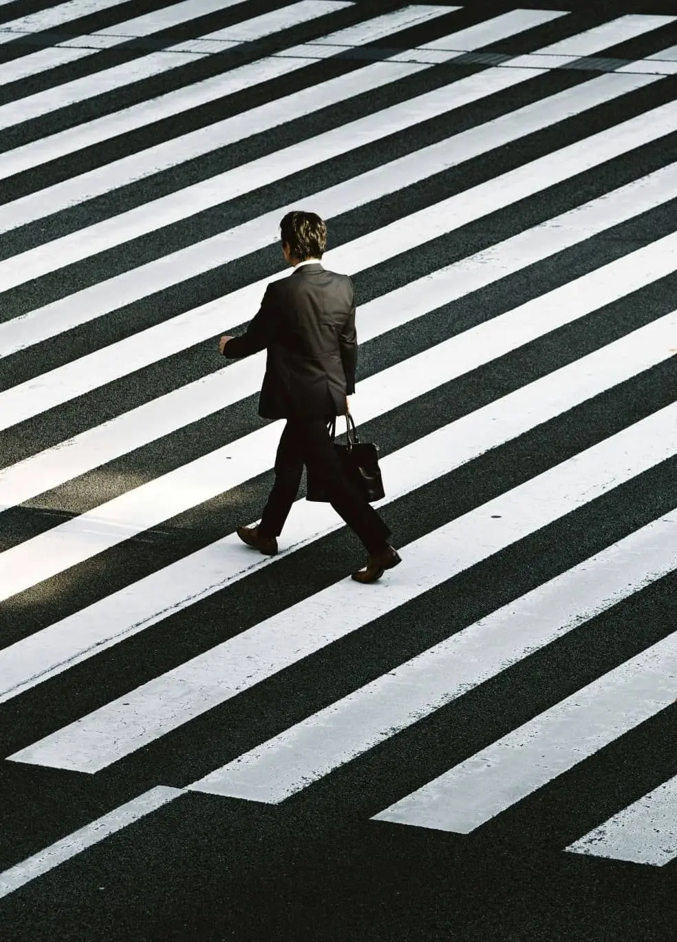 Man Walking Down Cross Walk